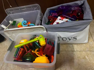 Mixed set of colorful plastic building tiles and preschool toys - used