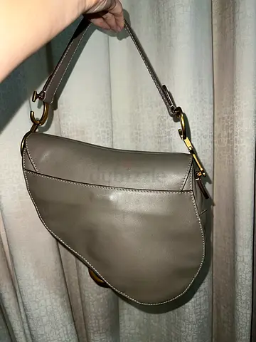Gently used leather saddle shoulder bag with gold-tone hardware