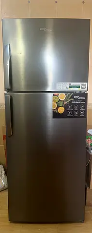 Gently used double-door refrigerator - 2-door top freezer, stainless steel finish