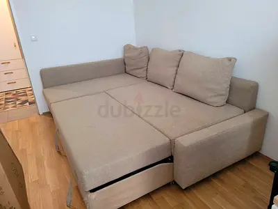 Beige L-shaped Sofa Bed with Storage — Good Condition