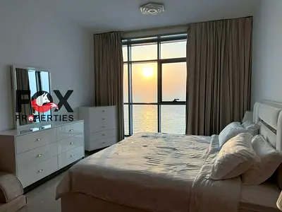 Luxury furnished 3BR apartment with full sea view in Corniche Residence Ajman, prime waterfront location near top restaurants and services, modern fur