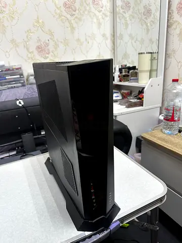 MSI MPG Trident with ASUS ROG Strix XG27AQDMG 27-inch OLED gaming monitor