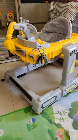Yellow baby walker with activity tray - gently used