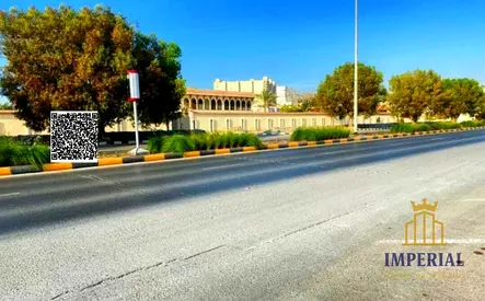ارض سكني تجاري للبيع (G+6) مقابل جمعهيه اسواق عجمان علي الشارع الرئيسي في الراشيديه 3