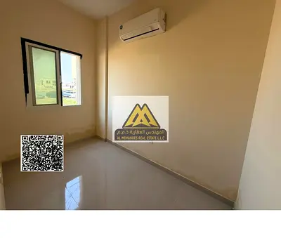 Studio in Al Alia, Ajman, separate kitchen, split AC, ground floor, AED 1,700 monthly, sewerage included, AED 700 refundable deposit, clean building,