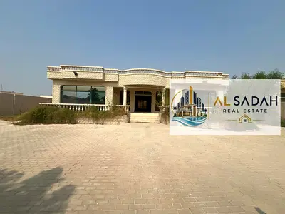 Ground floor villa for sale in Al Ghafia. Area: 8016 sq ft. 4 bedrooms, living room, 3 bathrooms, and a large yard. The villa is located on a 24-meter main street and a 12-meter dirt road at the back.