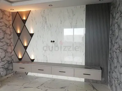 TV unit with integrated display shelves and marble-look panels