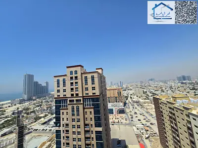 Two-bedroom apartment with a living room and a closed kitchen for rent in Ajman One Towers.