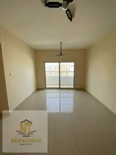 Two-bedroom apartment with a living room for annual rent in Abu Shagara, with no administrative fees