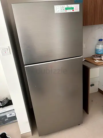 Stainless steel double-door refrigerator in very good condition. Less than 6mths old