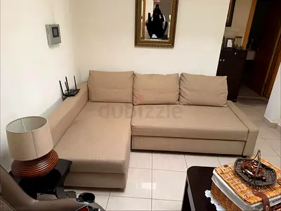 Beige L-shaped Sofa with Storage - Good Condition