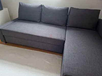Gray L-shaped Sofa Bed with Storage - Good Condition