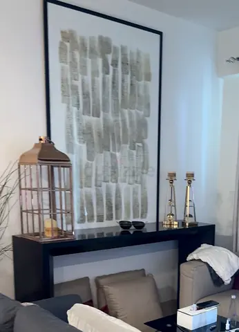 Brown Console Table with Decorative Accents - Good Condition