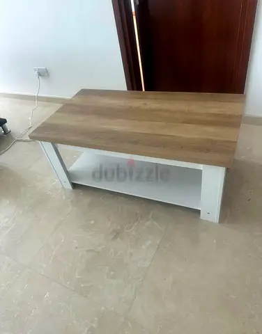 Simple two-tone wooden coffee table with lower shelf