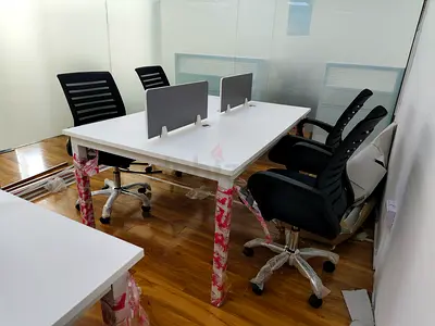 White 4-Seater Office Desk with Partition Panels and 4 Ergonomic Chairs