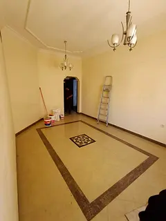 1BR apartment in clean tower, balcony, partition, prime location, easy access to Dubai, free yearly