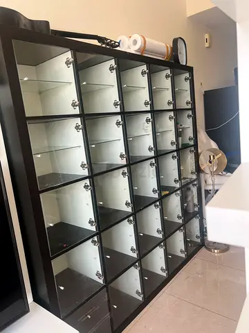 Large Glass-Front Display Cabinet with Multiple Cubby Shelves