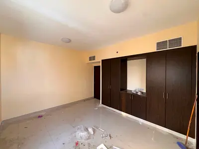 🏡 Two-bedroom apartment with a living room for annual rent in Al Nuaimiya 1, Ajman – prime location near Al Hikma School, with a balcony, central air