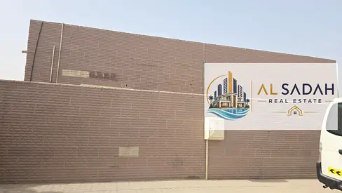 For sale: A corner house in Umm Khanoor, divided into two sections. The first section has 4 bedrooms, a living room, a majlis (formal sitting room), and a kitchen. The second section has 3 bedrooms, a