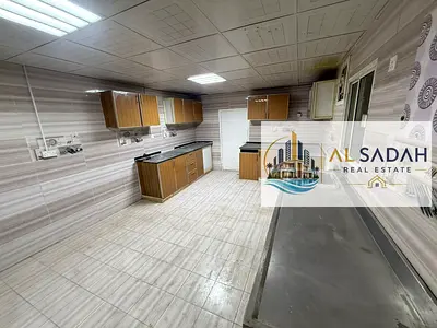 A house for rent, divided into two sections. The first section has 4 bedrooms, a living room, a majlis (formal sitting room), a kitchen, and 3 bathrooms. The second section has 2 bedrooms, a living ro