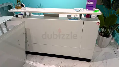 White modern reception counter / front desk in good condition