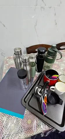 Various reusable bottles, travel mugs and kitchen accessories - set of items