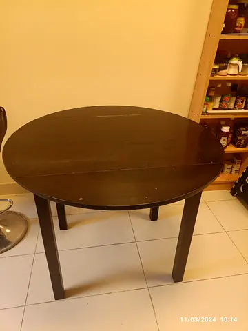 Used round wooden dining table (dark brown) - seats 4