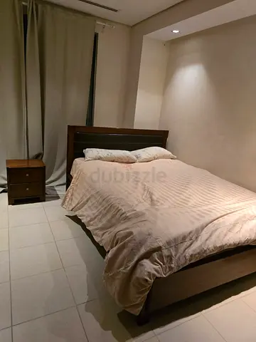 Queen wooden bed frame with matching nightstand - good condition