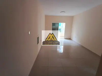 Luxury Family Apartment for Rent in Al Hamidiya 1 - Spacious Living Areas and Built-in Wardrobes