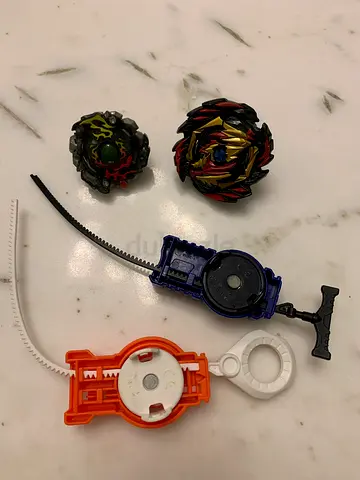 Beyblade spinning tops and launchers