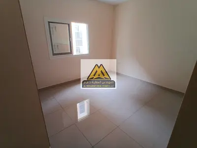 Two-bedroom apartment in Al Hamidiya 1, Ajman, 2 bathrooms, balcony, built-in wardrobes, central AC, spacious, 41,000 AED yearly, 4 installments.