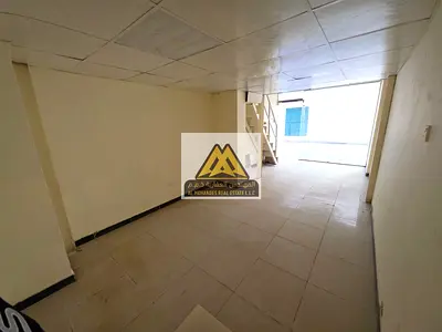 Commercial mezzanine shop in a prime location in Ajman, Al Rashidiya - mezzanine provides additional space - vibrant area with high population density