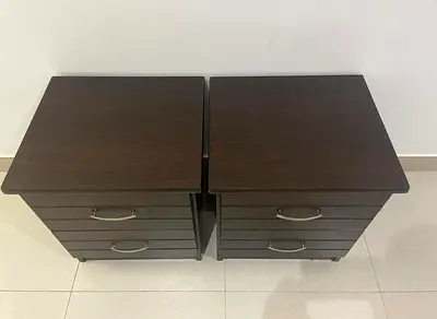 Pair of dark wood bedside drawers - good condition