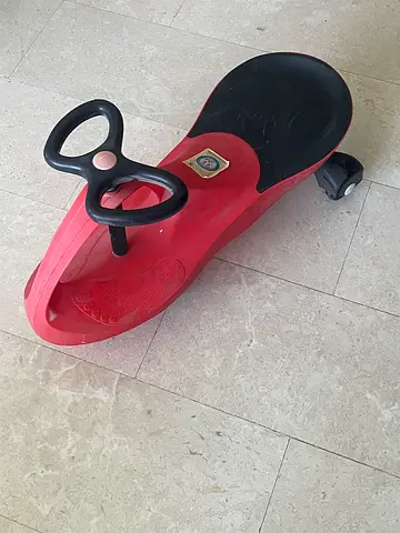 Red ride-on wiggle car / toddler push car - used