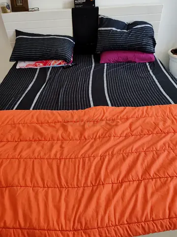 King size bed with storage space and accessories