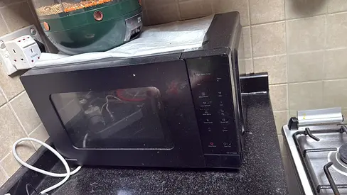 Used Black Countertop Microwave Oven - Good Working Condition