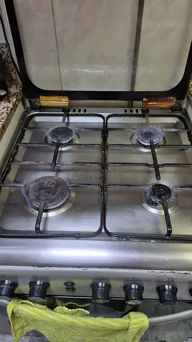 Used 4-Burner Stainless Steel Gas Stove with Oven - Good Working Condition
