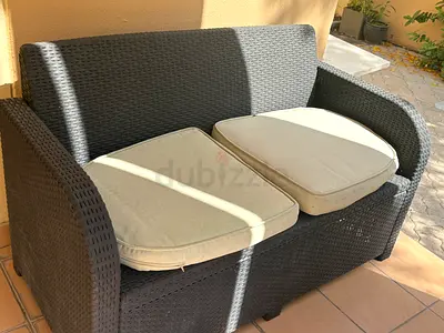 Outdoor Wicker 2-Seater Sofa with 2 single seats and a table and Cushions — Good Condition