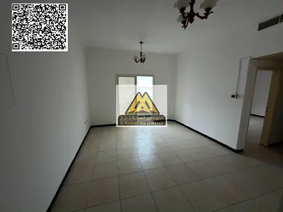 A 1-bedroom apartment with a living room for annual rent in Al Nuaimiya 2 – Ajman, located on King Faisal Street. It features a spacious layout, balco