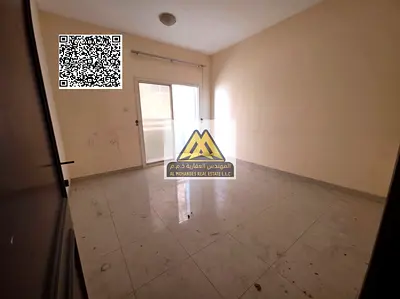 A spacious 1-bedroom apartment with a living room for annual rent in Al Hamidiya – Ajman, featuring a balcony with an open view and a practical layout