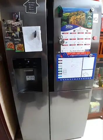 Used double-door refrigerator with water dispenser - good condition.