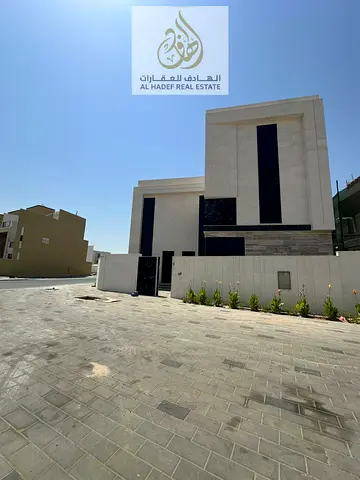 Annual rent in Ajman, Al Zahia area: a two-story villa consisting of 5 bedrooms, 6 bathrooms (master bedrooms), central air conditioning, a maid's roo