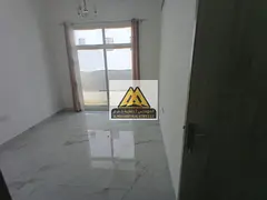 One-bedroom apartment for rent in Al Jurf 3 with a balcony, two bathrooms, and central air condition