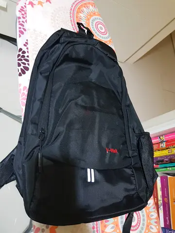 Black lightweight backpack with multiple compartments - good condition