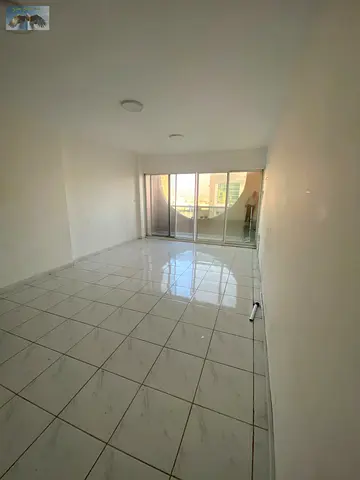 Two-bedroom apartment for annual rent in Ajman, directly on Khalifa Street, near Al Hikma School, Vivia Market, and Istanbul. The apartment features a