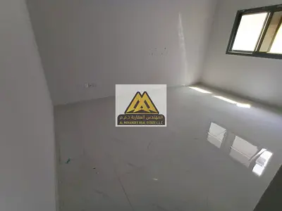 Apartment for rent in Al Jurf 3, Ajman, behind Ukraine, with a great size and luxurious design, including a master bedroom, in a modern building and c