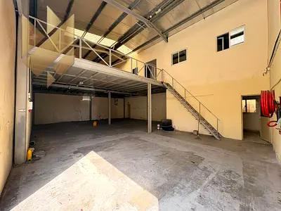 Special offer for rent: a warehouse in Industrial Area 13 with a practical size and a mezzanine