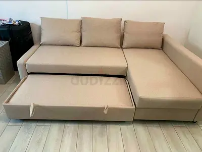 Beige L-shaped Sofa Bed with Pull-out Ottoman - Good Condition
