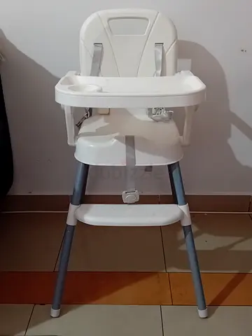 Simple white baby high chair with removable tray — excellent condition