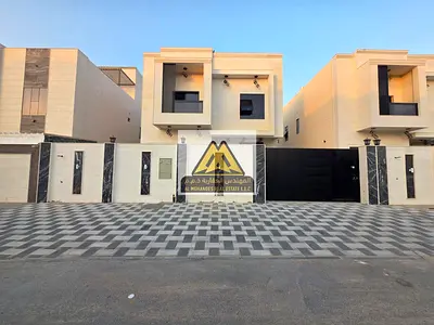 Al Zahya, Ajman, brand new and first occupancy, featuring a unique modern design and high-end finishing. The villa is located in a prime area directly